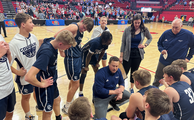 Cross County coach Jimmy Blex talks things over with his team before the start of the second half. PCN photo by Rick Holtz