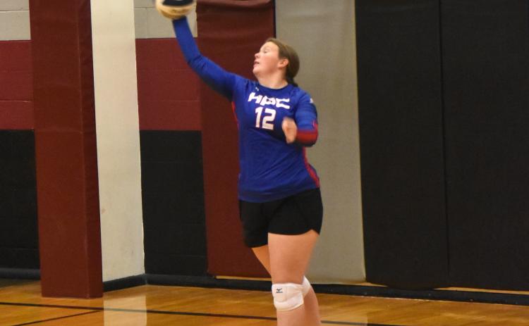 Allie Howell serving against Lawrence-Nelson.