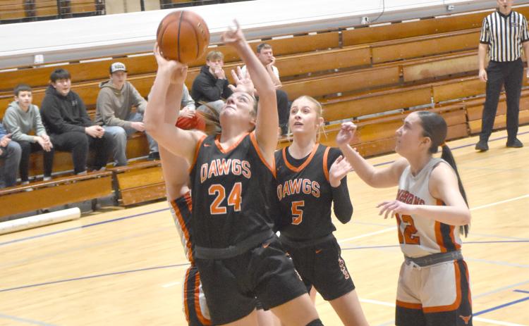 Bella Recker puts up a bucket.