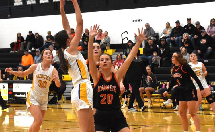 Leah Whitmore (SRC) goes up for a basket while Halle Gabel (OSC) defends. PCN photo by Beth Sparrow.