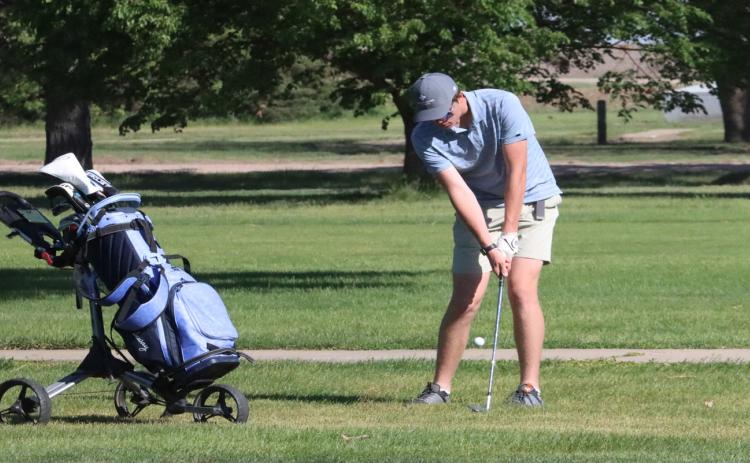 Above-CRC Meet champion Brock Allen hits his recovery shot from the left rough on hole No. 3. Allen fired a 71 to best Carson Loos of BDS who carded a 79.