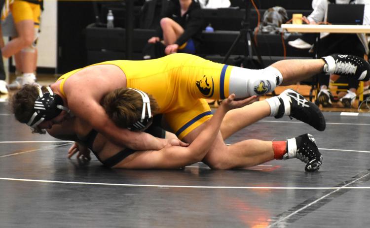Senior Ethan Fjell pins Preston Kumm (Howells-Dodge) on Saturday. PCN photo by Beth Sparrow.