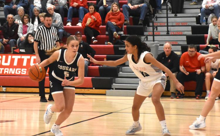 Cougar senior Edie Peterson drives around the Sutton defense in last Thursday night’s game. PCN photo by Beth Sparrow.
