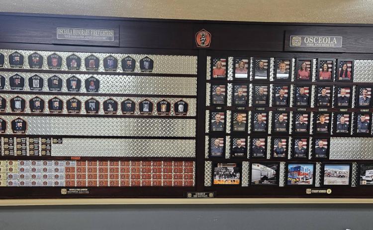 Osceola fire finished their honorary firefighter wall. Close up of some of the plaques are to the right with a legend. Years of service determined the color of the plaque. Photos were provided.