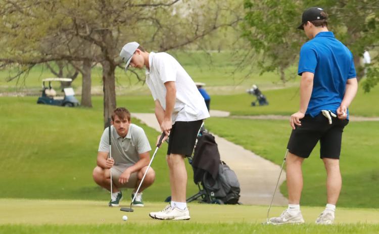 Shelby-RC’s Jaxon Carter strikes his putt on the 14th hole at Quail Run on Thursday during the Scotus Central Catholic Invite Carter led the Huskies as he fired a 47 on the front side and a 43 on the back. PCN photo by Ken Kush.
