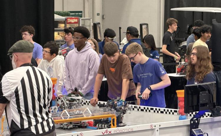 Pictured is 5155E (Sam Haug and Brad Lott on the right) talking to a team from Switzerland in their last qualifying match. Photo provided by Heather Haug.