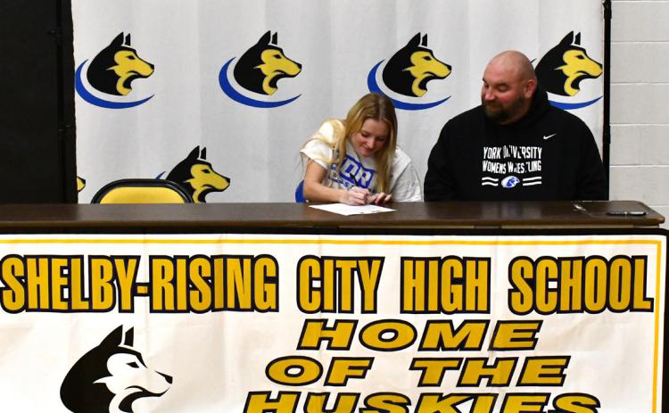 Bailey Turpitt signed to wrestle at York University. She is pictured with the University coach. Photo provided by S-RC yearbook.