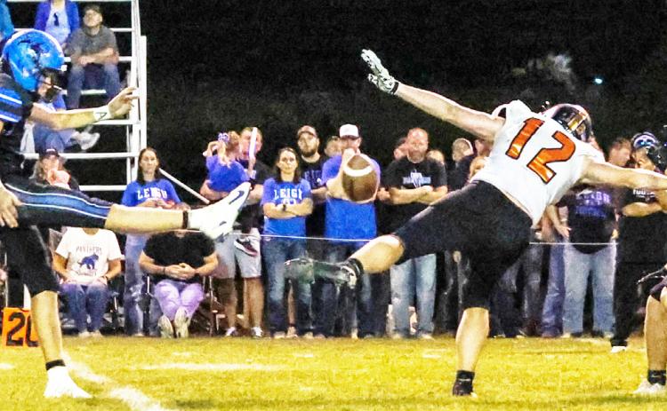 Osceola’s Kolton Barr (12) blocks Leigh punt in fourth quarter to set up game winner for the Bulldogs. PCN photo by Blaine Winslow.