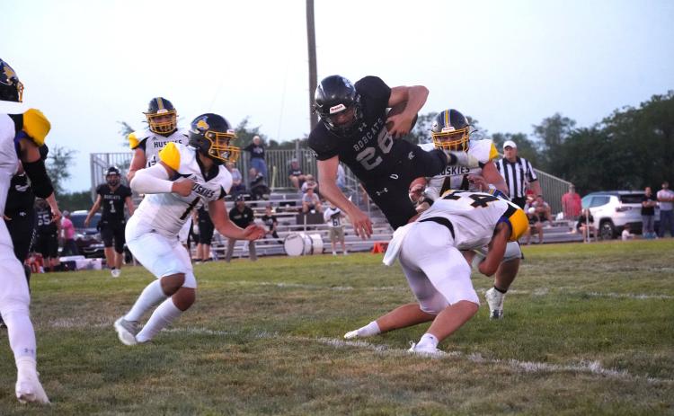Dalton Pokorney gets the hit on an EMF runner as Owen Krafka and others are ready to lend a hand. PCN photo by Jen Vrbka.