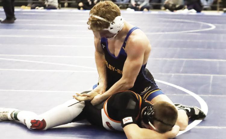 Shelby-RC’s Logan Lindsley works on Cambridge’s Carter Shoemaker in the Huskies dual opener on Saturday against Cambridge.PCN photo by Ken Kush.