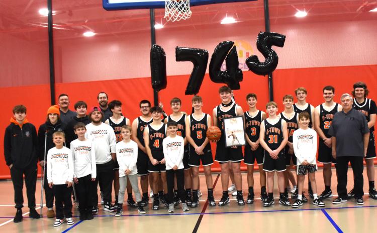 Above: Kale Gustafson (center) is pictured with his team after breaking the school career record for points. Below: Former record holder Isaiah Zelasney is pictured with Kale Gustafson. The two played together the last three years before Zelasney graduated. PCN photos by Beth Sparrow.