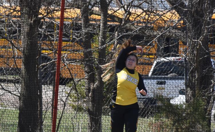 Left: Nevaeh Martinez (SRC) throws the discus at the Osceola meet.