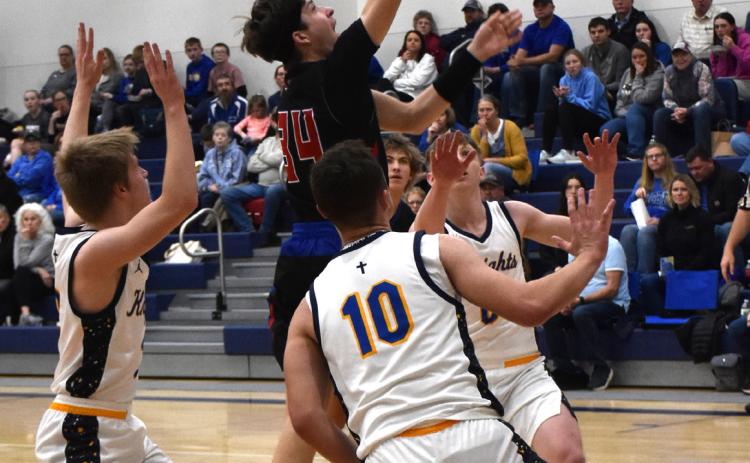 Maddix Fuhrman goes up for a shot against Nebraska Lutheran. He had 12 points in the game. PCN photo by Beth Sparrow.