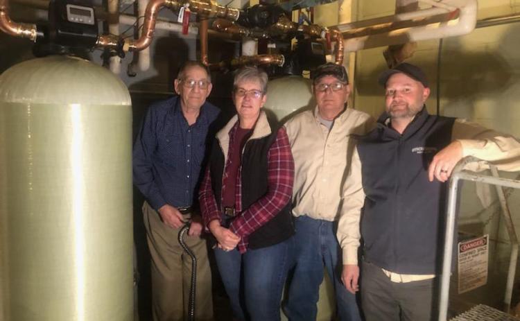 Dennis Jasper, Darla and Rick Boroviak, and Tyler Lindburg are pictured with the new water softener system installed at Midwest Covenant Home. Dennis installed the original system over 40 years ago with the help of his (now) son-in-law Rick. Dennis, who resides in The Plaza at Midwest Covenant Home got to be 'on the job' again as Rick and Tyler installed the new system.