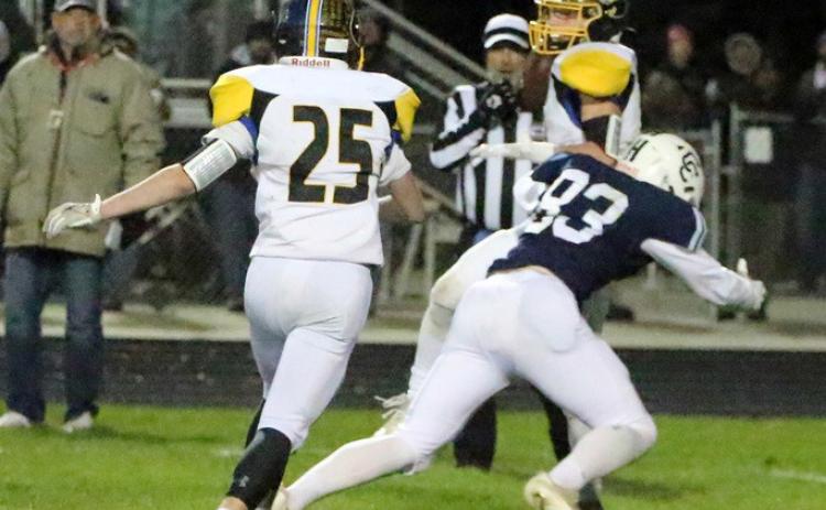 Langdon Arbuck (CC #83) takes the football down field as Gabe Dutton-Mofford (SRC #25) pursues him. PCN photo by Travis Lane.
