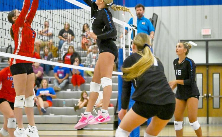 Hallie Jo Urkoski (9) of High Plains tries to block the attack of the Twin River’s front row in Tuesday game in Genoa. Photos by Jen Johnson.