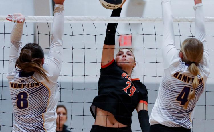 Graci Conkling hits a kill against Hampton. PCN photo by Blaine Winslow.