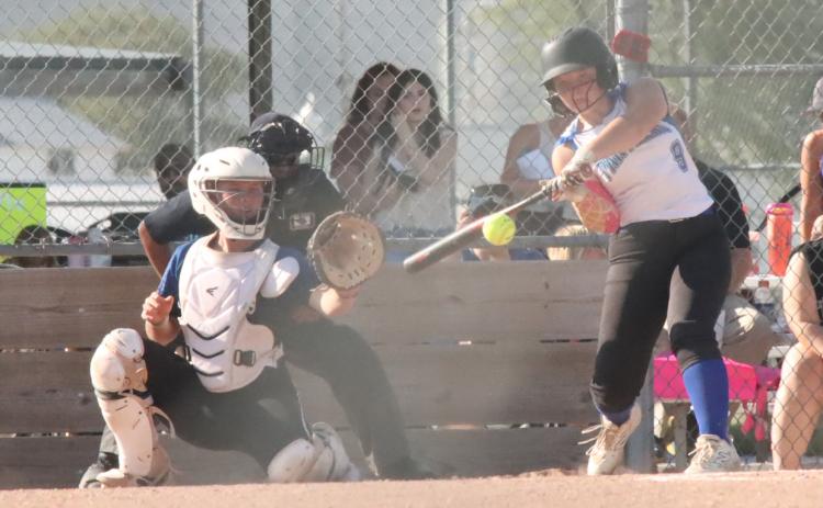 Blue River’s Ashlyn Long rips a single and drives in two of the four she drove in as the Blue River Panthers opened with an 8-4 win over Guardian Angels Central Catholic.Long went 8 for 16 with nine RBI’s as the Panthers went 4-1 the first week. PCN photo by Ken Kush.
