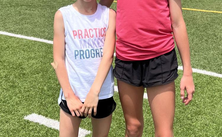 Evelyn Christy (left) participated in the 50, 100 and 200-meter dashes. She placed fifth in the 50-meter and sixth in 200-meter dashes. She will be a 4th grader at Osceola. Kasilyn Prososki (right) qualified for state in the mile and 800-meter run for her age. She placed second in the mile and sixth in the 800. She will be a 7th grader in Osceola. They participated in the regional meet in York on May 12th and the top four quliafied for state in Kearney. Photo provided.