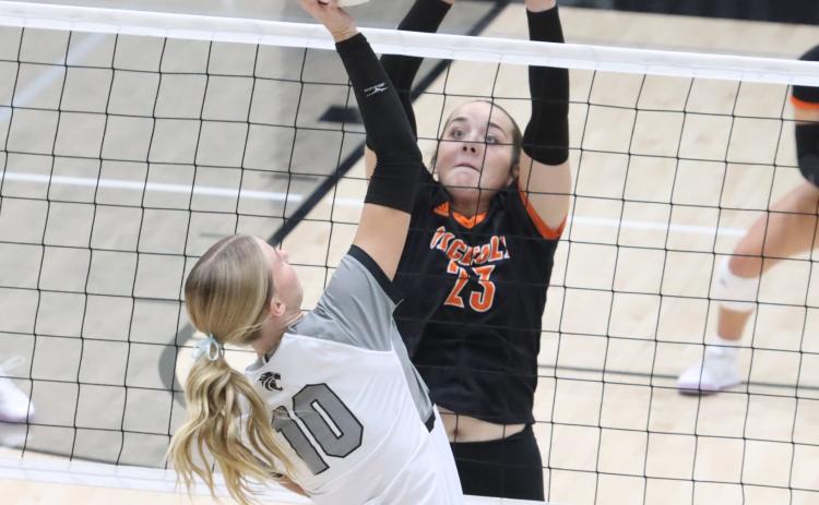 Osceola junior Bella Recker (23) is set up for the block on the attack of EMF’s Aniston Meints in last Tuesday nights battle between the two state rated Class D1 schools. PCN photo by Ken Kush.