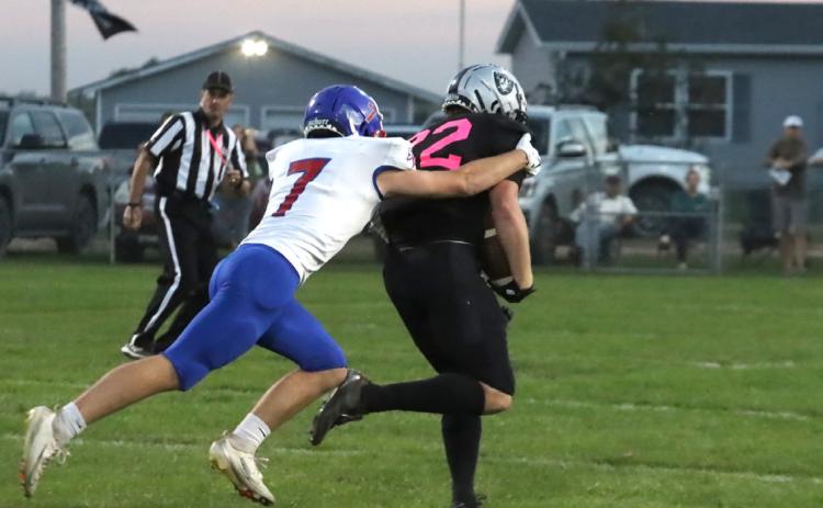 Storm junior Kyler Hans runs down L-N back Jackson Williams after a long gain during first quarter action in Lawrence this past Friday night. PCN photo by Ken Kush.