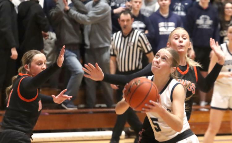 Cross County Cougars senior Edie Peterson scores on a third quarter drive during the CRC Championship on Friday at the York City Auditorium. Peterson hit the game winner with under five seconds to play. PCN photo by Ken Kush