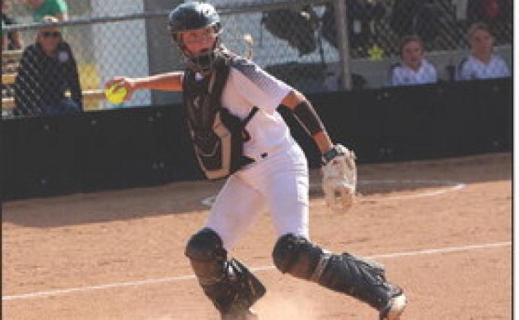 Emma Recker looks to throw to get someone out at the game against Gothenburg earlier this month. PCN file photo by Travis Lane.