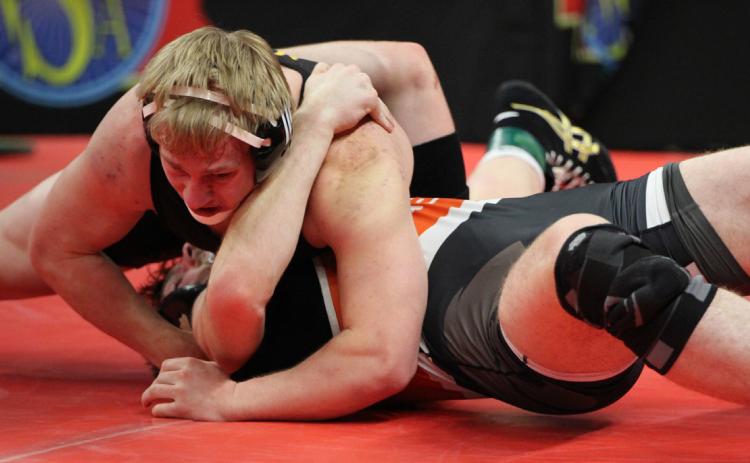 TOP- Huskies senior Eli Fjell pinned Maxwell’s Trevor Manta in the 190-pound Class D final on Saturday. Fjell repeats as a state champion.