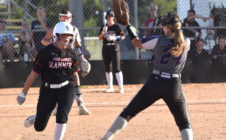Polk County Slammers freshman Chloe Schott beats the throw to first base as the HWY 91 first baseman bobbles the throw. Schott went 3 for 4 with three RBI in her varsity debut. PCN photo by Beth Sparrow.