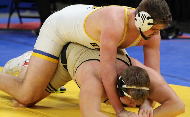 Collin Vrbka dominates an opponent in wrestling last season. Vrbka won the Class D 285 weight class last year, and looks to repeat. He just signed to play football for Wayne State. PCN file photo.