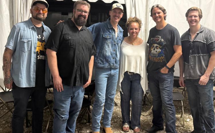 Lisa Shoup of Stromsburg (3rd from left) with Praise and Harmony, went backstage at the Nebraska State Fair and met members of Home Free. Pictured are Adam Rupp, Rob Lundquist, Adam Chance, Shoup, Tim Foust and Adam Bell-Bastien. She is friends with Tim Foust due to her singing with the national group Praise and Harmony. Photo provided.