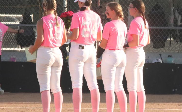 Polk County seniors (L-R) Mady Berggren, Adrienne Waller, Shyenne Krol and Kcin Confer are recognized before the final home game against Pierce. The season came to and for the PC Slammers, losing to Kearney Catholic 12-1 in the C-4 subdistrict. PCN file photo by Ken Kush.