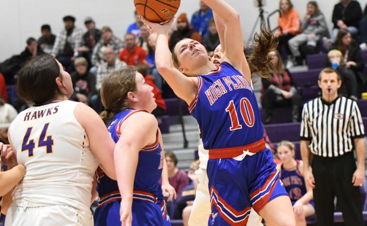 Hailey Lindburg absorbs contact on her way to the basket against Hampton. PCN photo by Calvin Holtz