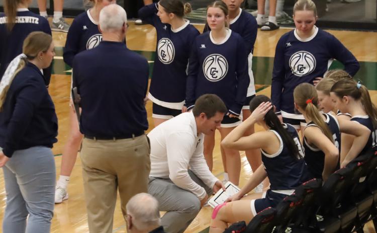 Cross County head coach Mitch Boshart meets with the team just before the tip against Central City in early January. Boshart and company hits the road to Greeley and Central Valley High School for the D1-6 District final on Friday. PCN file photo by Ken Kush