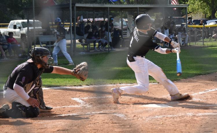 Conner Schnell, Rebels catcher, gets ready as a batter goes for the ball. PCN file photo by Beth Sparrow.