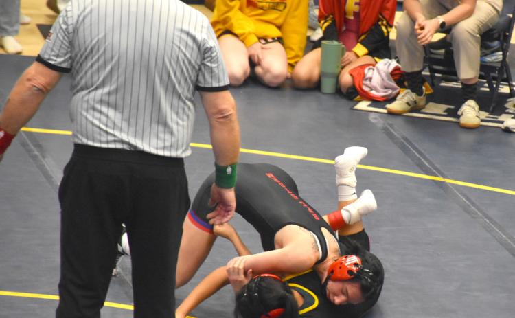 High Plains senior Dakota Gress makes quick work of Fairbury’s Keira Bay at 125 pounds. Gress finished third at the York Invite this past Friday. PCN photo by Beth Sparrow.