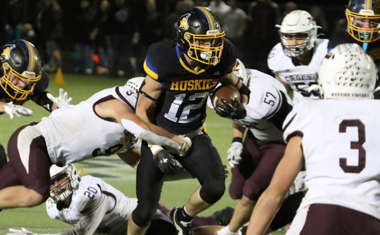 Shelby-RC junior running back Jett Vrbka (12) carried the load Friday night for the Huskies as he ran for 113 yards on 19 carries against a tough Crofton defense. PCN photo by Ken Kush