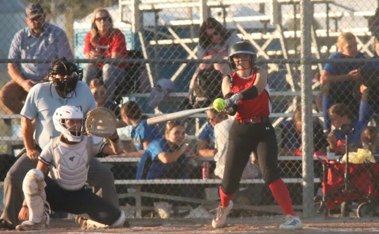 Cross County Slammers senior Shyenne Krol gets just enough of this pitch to dump it into centefield for a hit in the loss to York in David City. PCN file photo by Ken Kush.