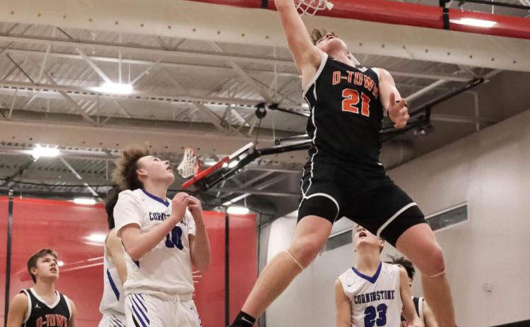 Above: Kale Gustafson goes up for the dunk against Cornerstone Christian. PCN photo by Blaine Winslow.