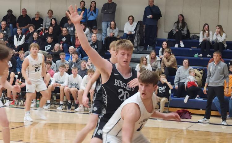 Tanner Hollinger dribbles it by the basket. PCN photo by Craig Pinley.
