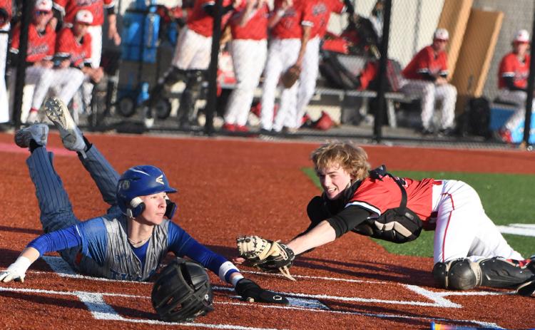 Boston Hinkle slides into home for the first run of the game. PCN photo by Rick Holtz.