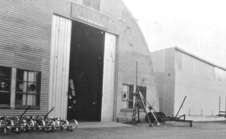Osceola Implement will celebrate 80 years. Here is an early picture of their two buildings. Their current building was built over these two existing buildings. Read the incredible story in this week’s special section on Ag Week. Photo provided.