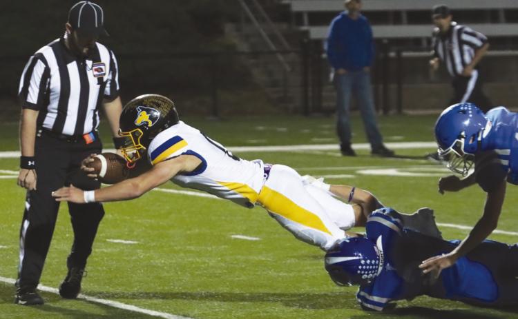 Shelby-RC senior Carter Eickmeier dives over the goal line for his third touchdown of the game at Lourdes Central Catholic onj Friday at Peru State College. He finsihed with 287 yards, and five touchdowns in the D1 battle. PCN photo By Ken Kush