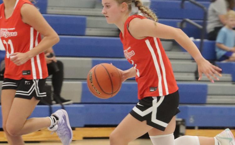 Above- Shelby-RC’s Taya Pinneo dribbles the ball down the court for the Red team. Pinneo closed out her high school career playing in her final all-star game at Centennial High School on Tuesday night. PCN photo by Ken Kush.