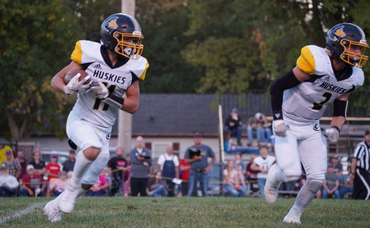 Carter Eickmeier runs the ball as Logan Lindsley blocks. PCN photo by Jen Vrbka.