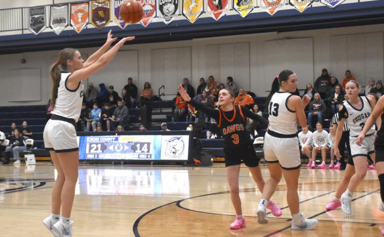 Cross County senior Edie Peterson gets a clean look at a 3-point attempt as the Osceola defense is late. Peterson scored 18 in the Cougars win on Friday. PCN photo by Beth Sparrow.