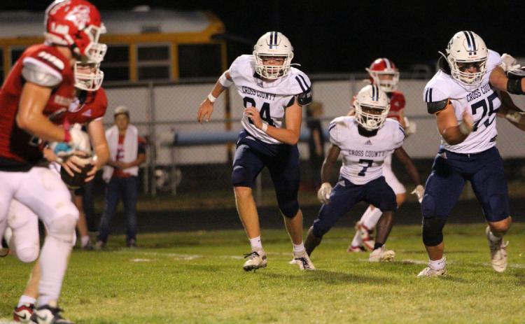 Wyatt Hengelfelt and Tyion Francis go for the ball carrier while Mason Quilhot blocks. PCN photo by Travis Lane.
