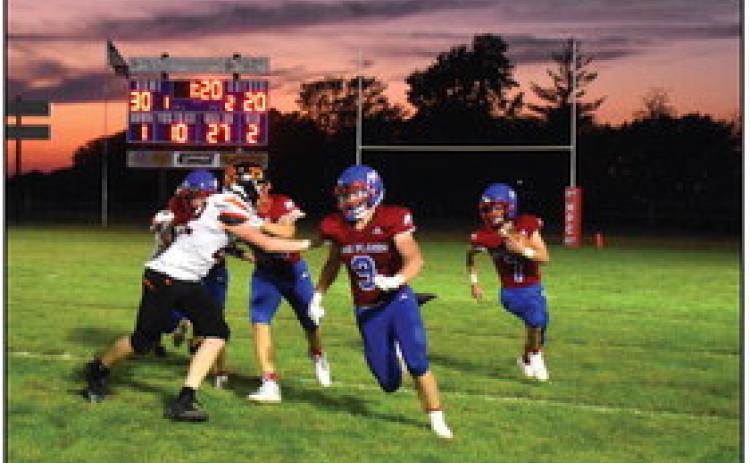Wyatt Urkoski leads the blocking for Haden Helgoth. PCN photo by Beth Sparrow.