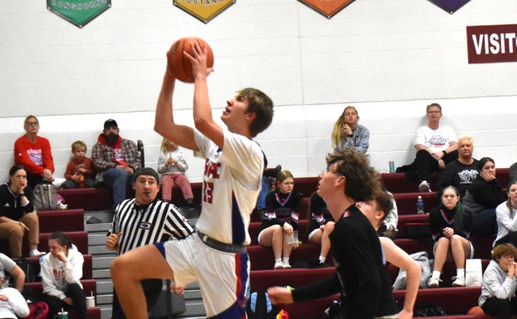 Carter Urkoski goes for the layup against Cedar Bluffs. PCN photo by Beth Sparrow.