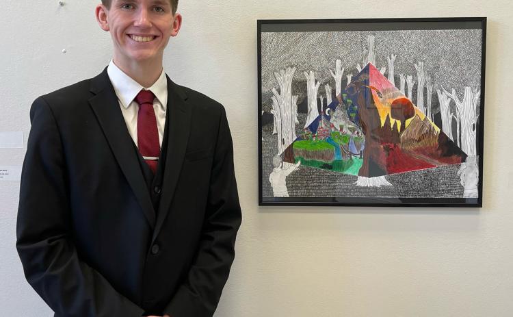 Hayden Lavaley stands next to his award-winning piece of art. The Osceola junior recently was named a Nebraska Young Artist Award winner. Photos provided